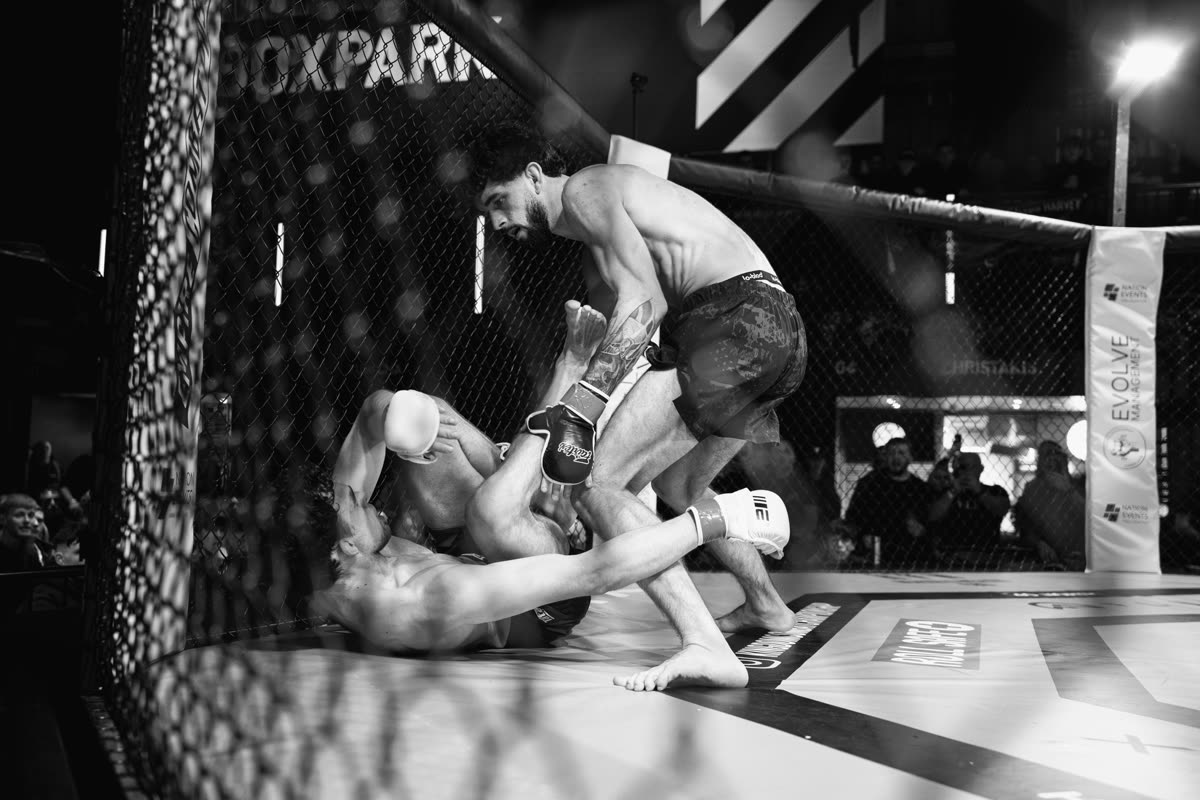 Pressing an opponent against the cage in a fight